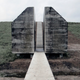 Illustration for article titled Watch a concrete WWII bunker get cut in half